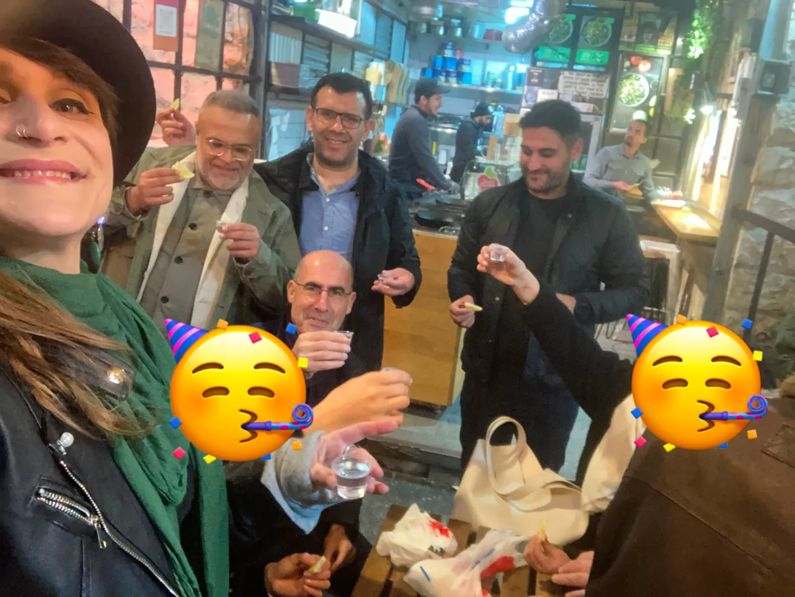 A group posing together for a selfie indoors