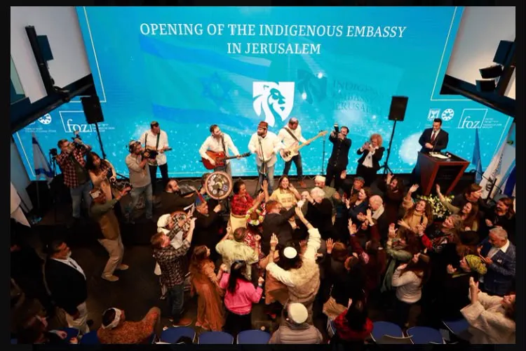 A group gathered around a stage with musicians performing