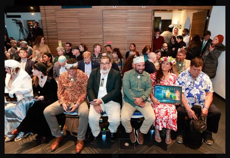 Attendees sitting in rows at an indoor gathering